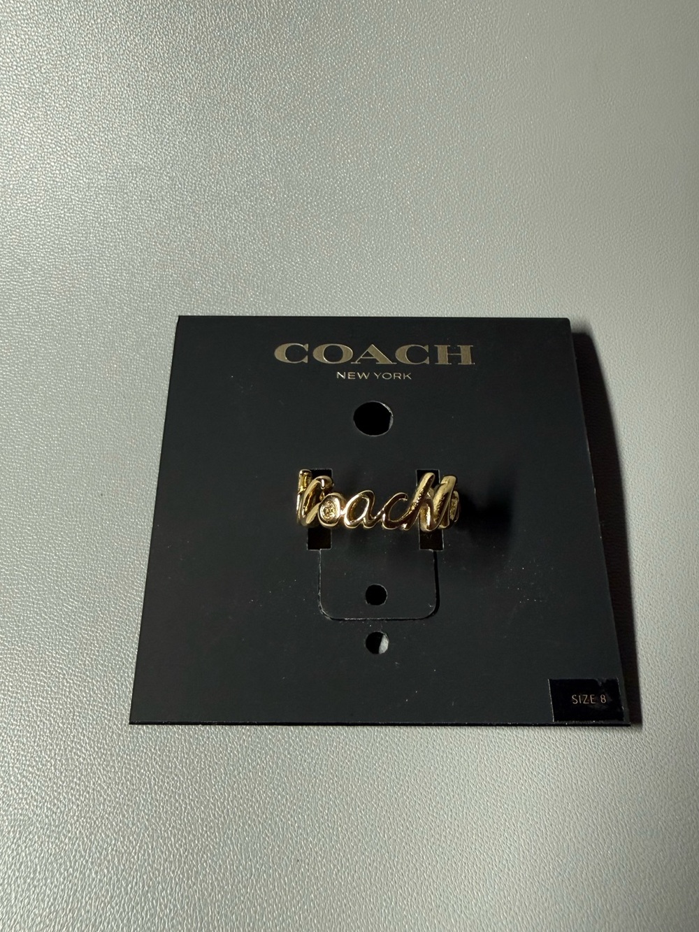 Coach Gold Script Logo Ring Crystal Accent Size 8 NWT- Price os Firm